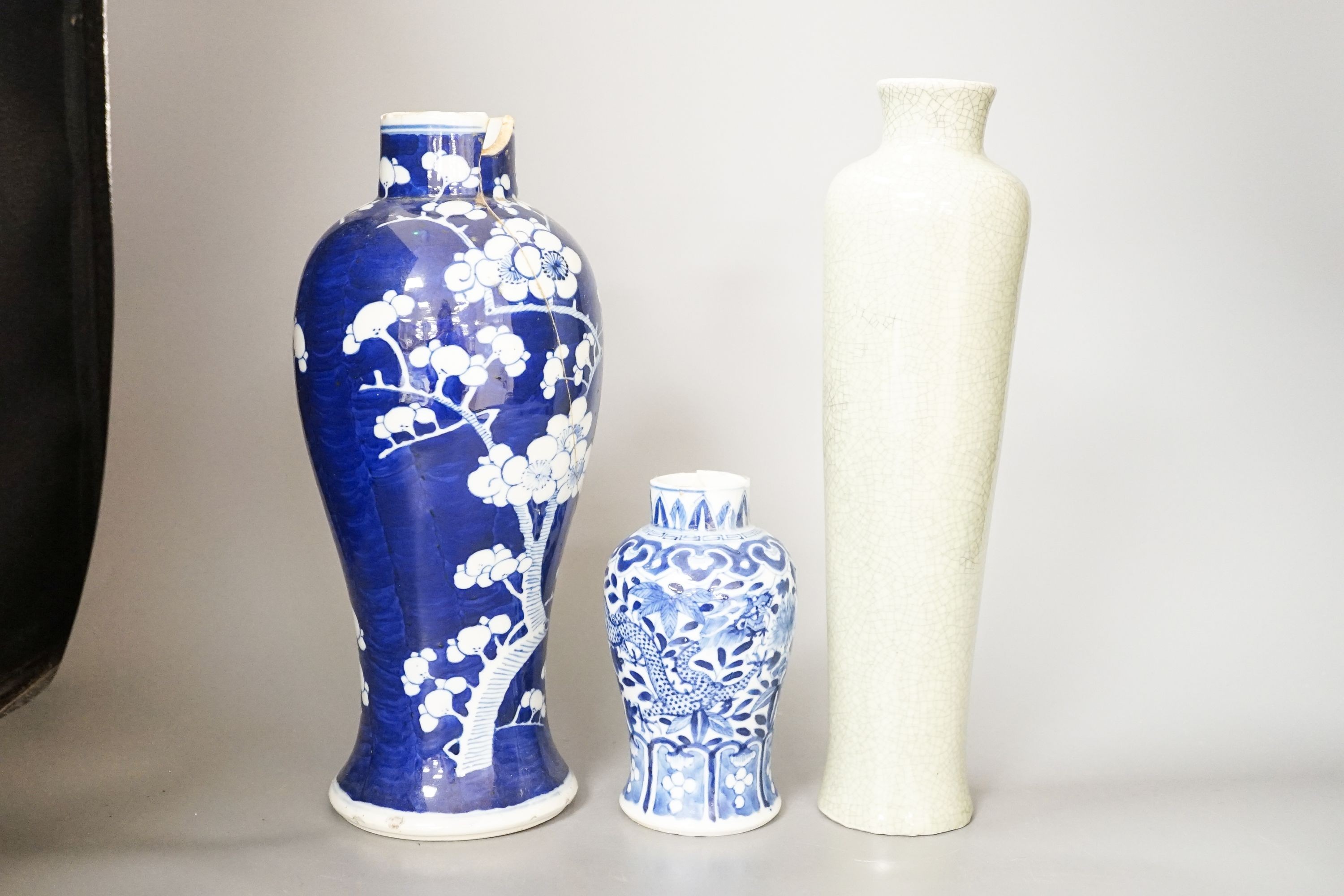 Two Chinese blue and white vases and a slender crackle glaze vase, Qing and later 30cm